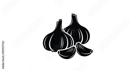 Black garlic bulbs and cloves presented as a striking silhouette