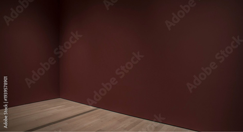 Modern empty room with dark red walls and wooden floor