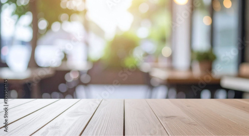 Cozy cafe interior with wooden table and blurred background
