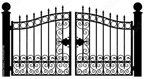 Beautiful black wrought iron gate with decorative scrollwork and spear top finials on pillars entrance to a grand estate or mansion driveway