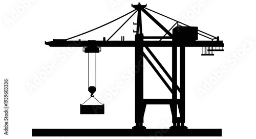 Industrial gantry crane lifting heavy load with hook and pulley system for efficient material handling and transportation in warehouse or construction site