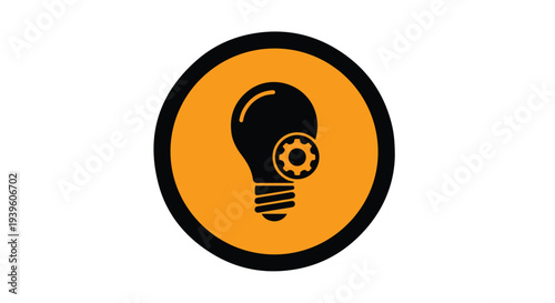 A close-up shot of a black and orange icon featuring a lightbulb with a gear on a white background with a minimalist and conceptual mood.