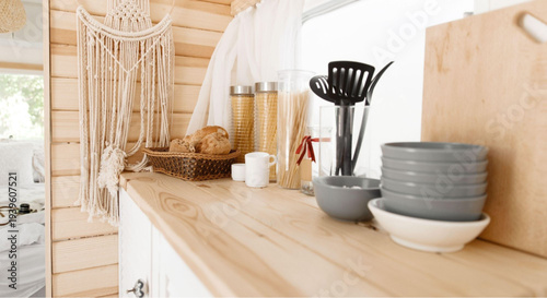 Cozy kitchen interior with wooden countertops and modern utensils