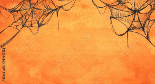 Spooky Halloween background with cobwebs on orange textured surface