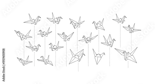Whimsical display of numerous origami cranes suspended by strings and floating in the air for a peace themed background.