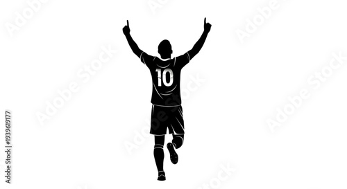 Silhouette of a triumphant soccer player in mid air