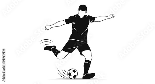 Soccer player kicking a ball in action