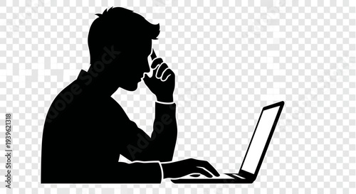 Silhouette of a man concentrating intensely while working on a laptop computer with his hand on... d