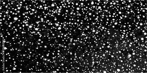 Abstract pattern of scattered white spots against a dark background