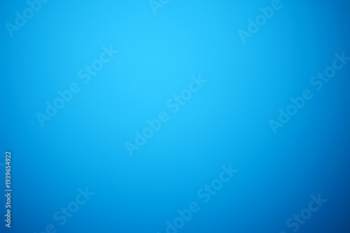 A plain background with a vibrant gradient of blue, creating a sense of depth and visual interest. 