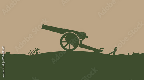 Silhouette of old cannon on green hill with barbed wire and tents at sunset