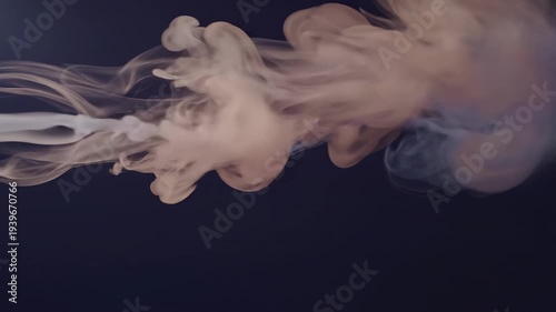 Ethereal streams of light-colored fluid expanding and blending against a dark backdrop, showcasing a delicate and organic abstract movement
