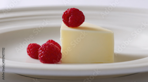 Wallpaper Mural Cream dessert with raspberry garnish on white plate Torontodigital.ca