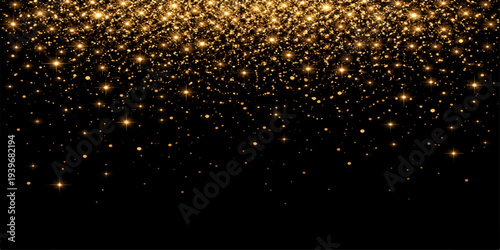 Elegant golden Christmas lights and shimmering bokeh stars create a festive winter background featuring falling snowflakes and bright gold holiday decorations on a shiny blue night texture