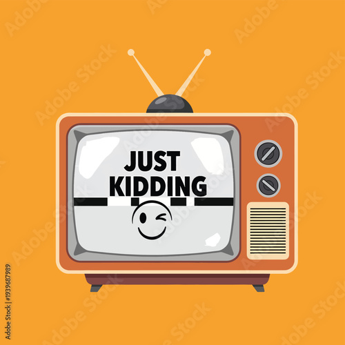 Retro television set with just kidding text and winking smiley face on screen for april fools day celebration isolated on bright orange background