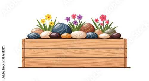 A wooden planter box contains dark soil, various smooth, colorful pebbles, and small blooming flowers in yellow, purple, and pink.