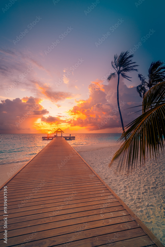 Fototapeta premium Radiant dreamy Maldives sunset beach with pier water villas palm trees vibrant colorful ocean horizon tranquil sky clouds serene summer destination