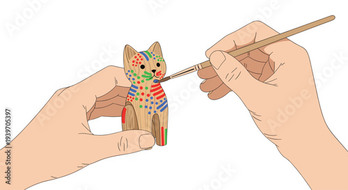 Hands delicately paint a small, light brown wooden cat figurine with colorful dots using a fine paintbrush on a white background.