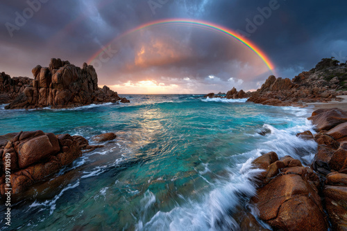 Rainbow over turquoise ocean waves and rocky beach