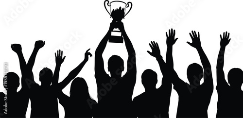 A group of people celebrating with a trophy in a victorious gesture