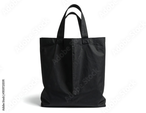 A black tote bag, with handles, stands alone against a white background. The image is a studio shot