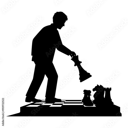 Silhouette graphic of businessman making final move with large chess king piece