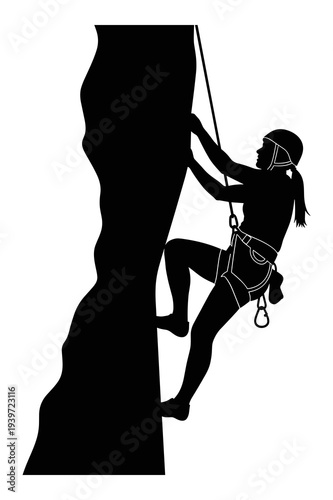 Adventurous woman rock climbing a sheer cliff with rope and harness