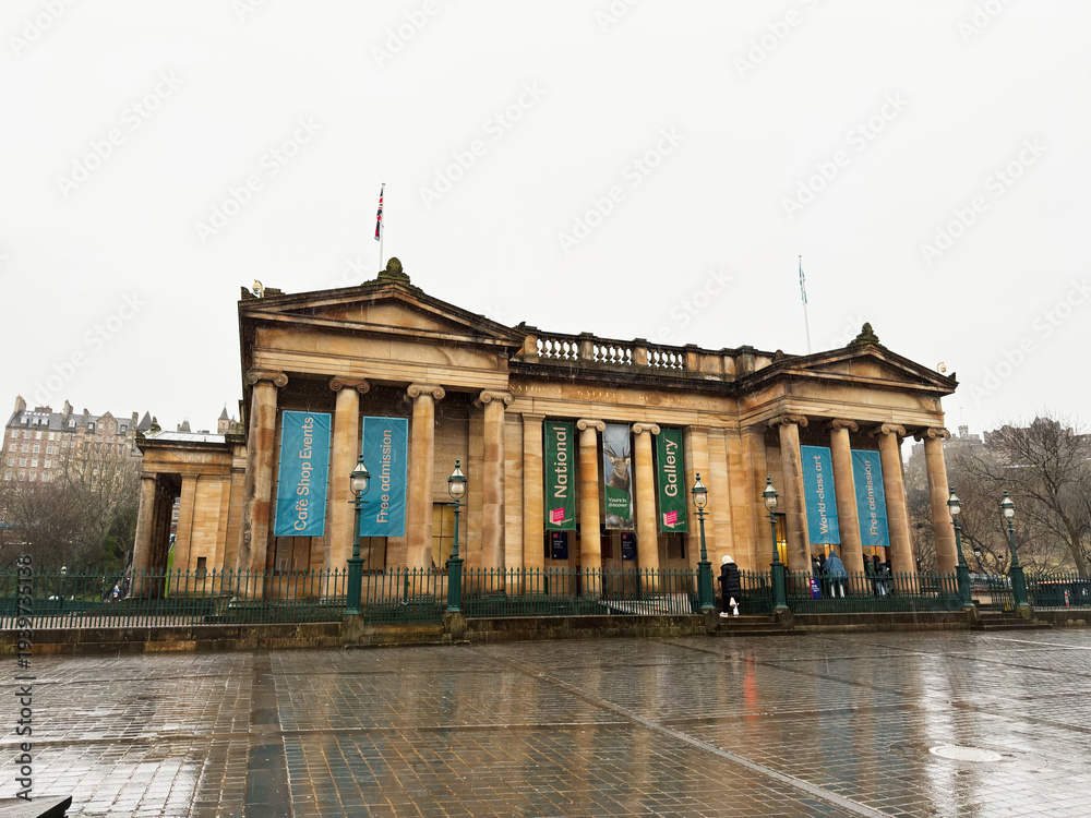 Fototapeta premium National Gallery neoclassical facade in Edinburgh, Scotland, UK on a rainy day with visitors at the sandstone portico