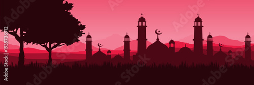 Panoramic red sunset Ramadan Kareem background with mosque silhouette and mountain landscape