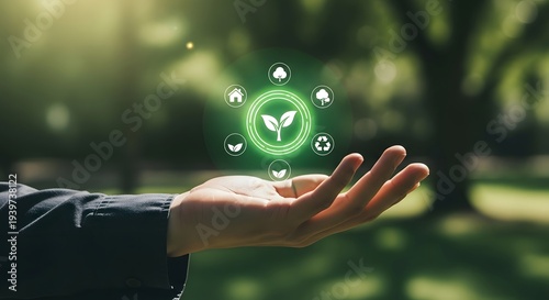 Hand holding glowing green circle with eco icons image