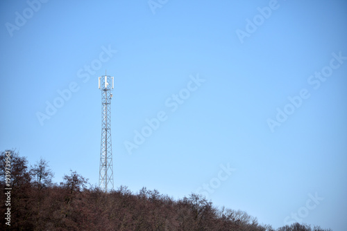 Tableau sur toile telephone tower, installed outside the city, on a hill