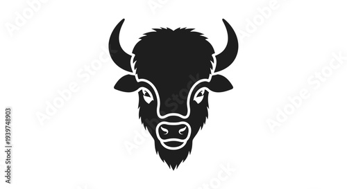 Black bison head with horns facing forward.