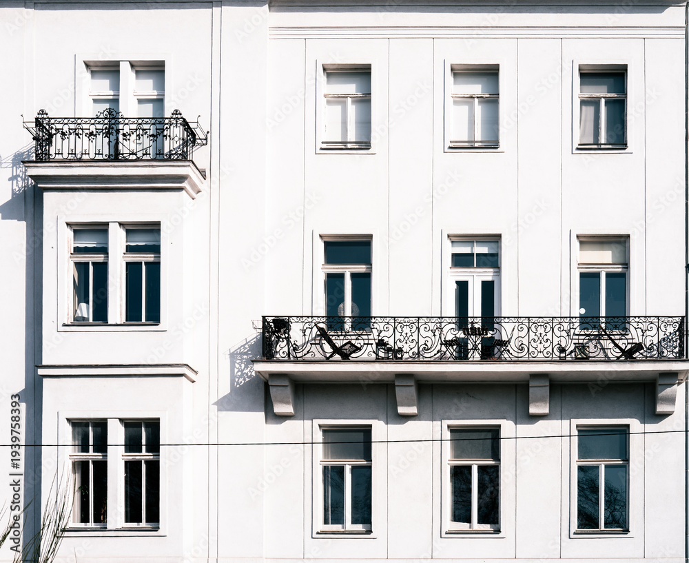 Obraz premium facade of an old building with metal balconies