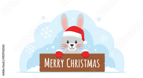 Happy gray rabbit wearing a red santa hat and matching mittens holds a rustic wooden sign that reads merry christmas in snowy weather.
