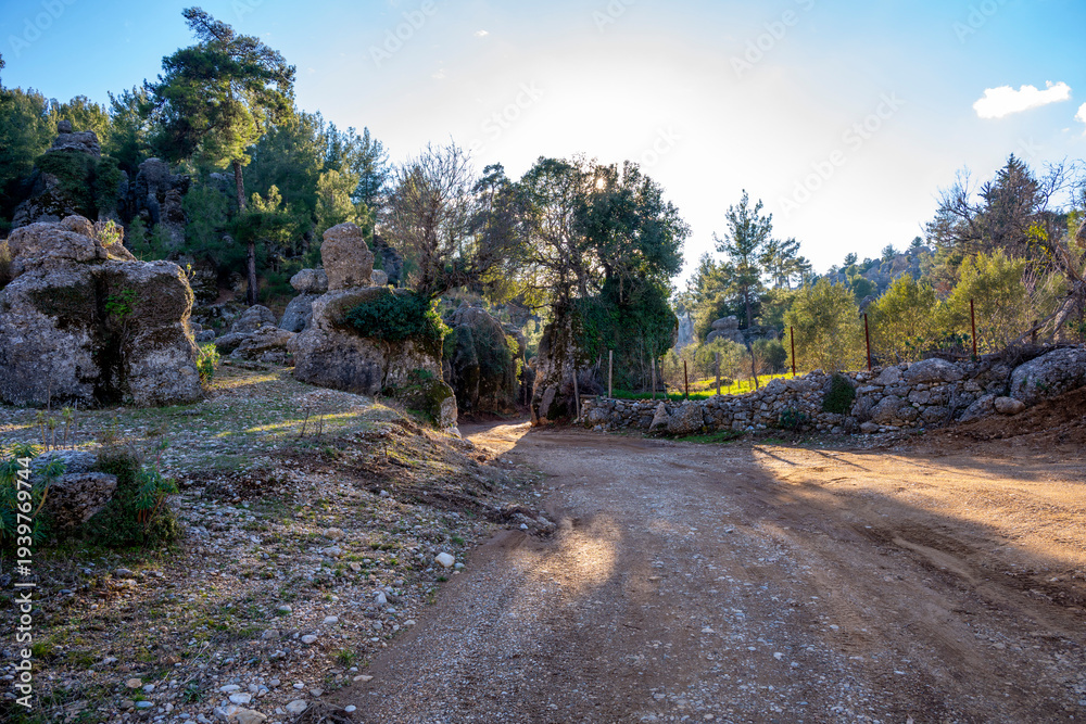 Fototapeta premium Adam Kayalar Selge. Adamkayalar Adam Rocks Sometimes, with their incredible rock formations resembling humans and sometimes animals, Adamkayalar evokes fairy-tale plateaus. Selge, Antalya. Ancient Sel