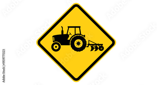 Road warning sign featuring a black silhouette of a tractor and plow on a yellow diamond, signaling drivers to exercise caution due to agricultural vehicles in the area