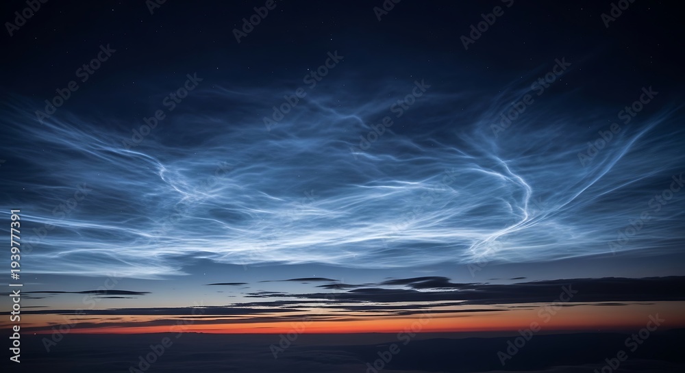 Obraz premium Enchanting Noctilucent Clouds dance across the twilight sky, their delicate luminescence creating a breathtaking and ethereal natural spectacle at the very edge of space