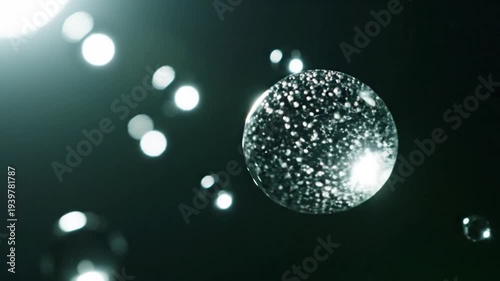 Abstract glowing spheres and bokeh on a dark background