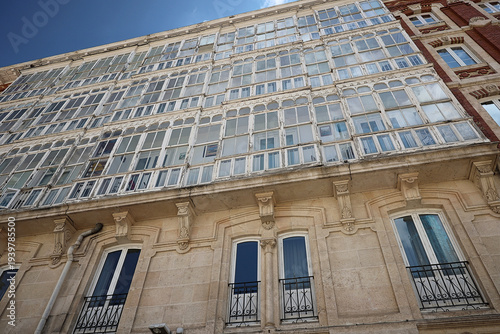 bourgeois house facade with glazed balcony in Burgos, Spain