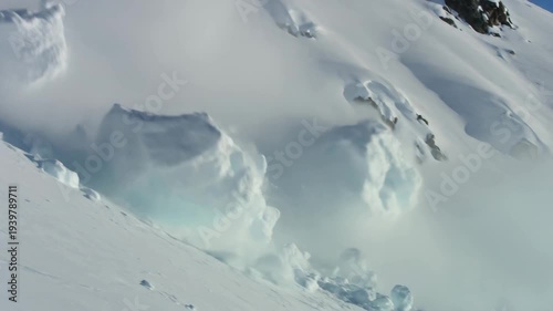 Powerful snow avalanche crashing down steep alpine slope, dramatic winter disaster scene highlighting natural hazard risk, mountain environment, climate effects, and extreme outdoor conditions
