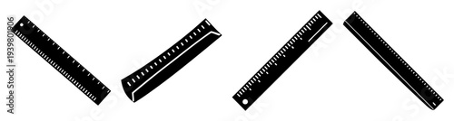 Three black and silver metal rulers aligned horizontally on white background for precision measurement tools