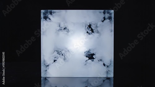 Abstract glowing sphere in glass cube on black background for modern designs