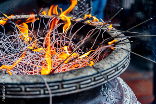 the solemn and sacred atmosphere of burning incense