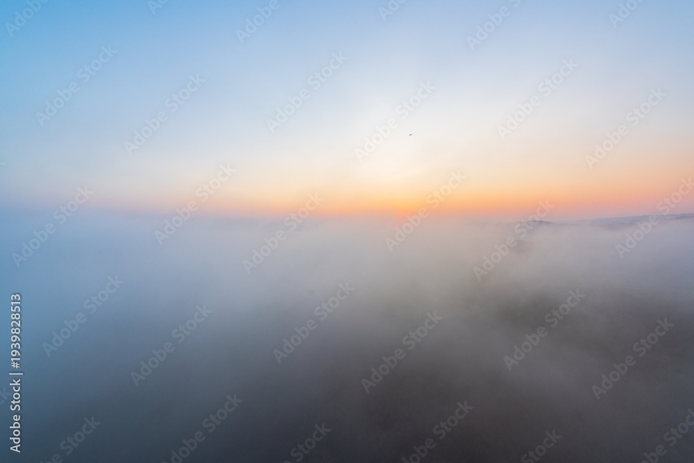 Fototapeta premium Rapeseed flowers at sunset in Jinji Peak Cluster, Luoping, Yunnan