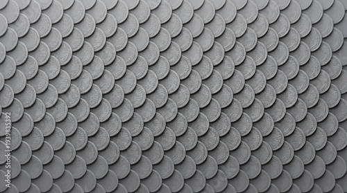 Gray roof tiles arranged in a diagonal pattern with overlapping scales.