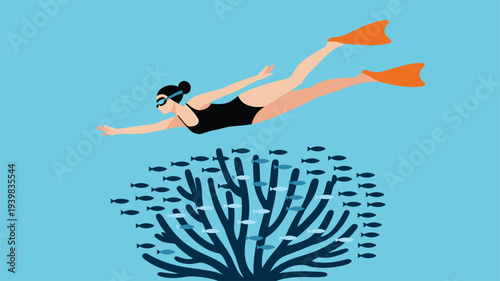 Woman in swimsuit and fins swimming gracefully over a blue coral reef with small fish