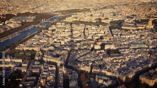 Showcasing Parisian charm and nostalgia an aerial view of Paris with the Seine River Shot in a Super 8 film style the footage has a blurry handheld retro film look travelogues documentaries and commer
