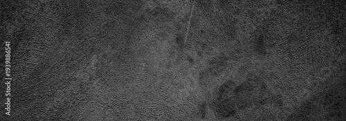 Black background of natural paintbrush stroke textured cement or stone old.Horror Cement Texture. Grunge scary background. Wall Concrete Old black