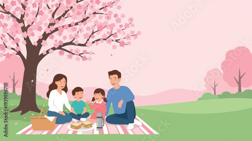 Family enjoying a delightful picnic under a blooming cherry blossom tree.