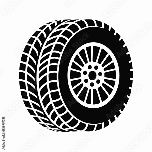 Black and white of a tire with tread pattern and wheel hub